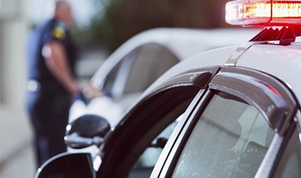 image of cop pulling over a driver