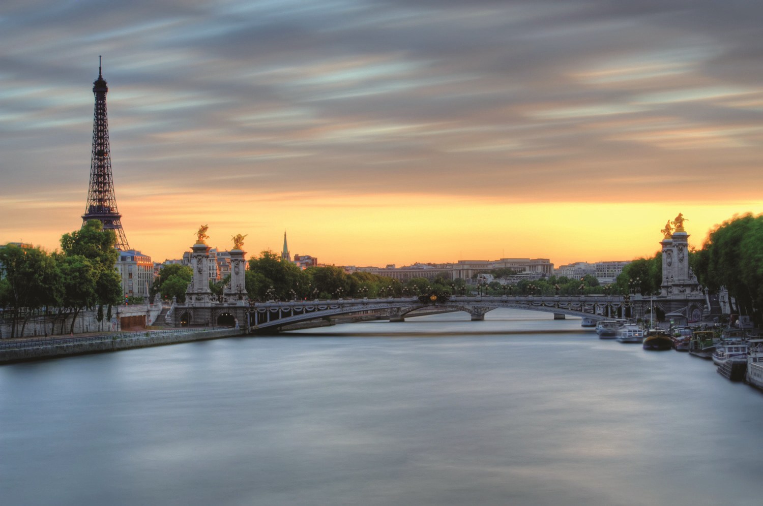 image of  Pont Alexandre III bridge over the Seine river in Paris, France