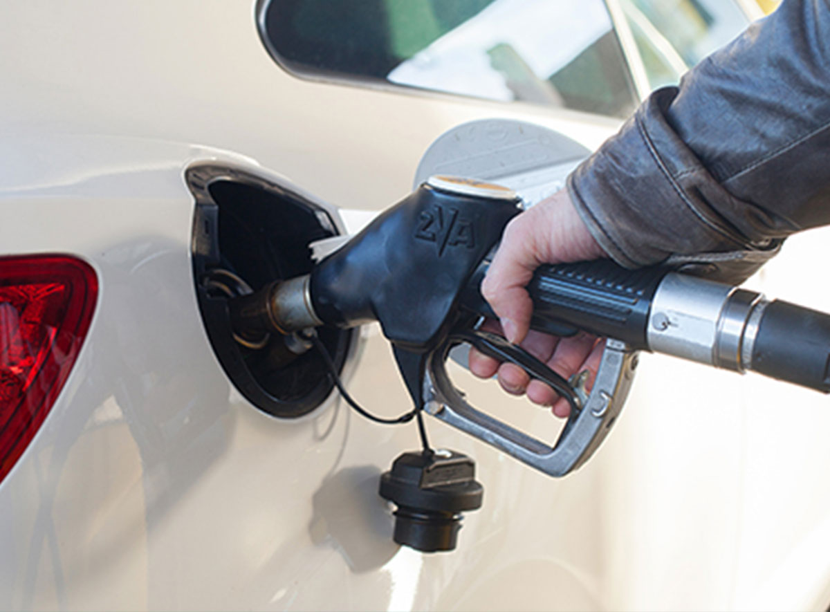 image of hand pumping gas with pump