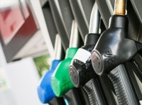 image of gas pumps blue, green, and black