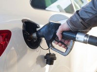 image of hand pumping gas with pump