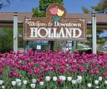 image of downtown Holland sign surrounded by tulips